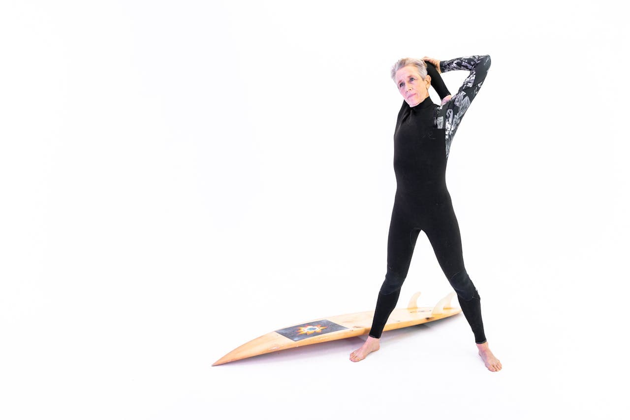 Woman in Black Long Sleeve Shirt Doing Arm Stretching