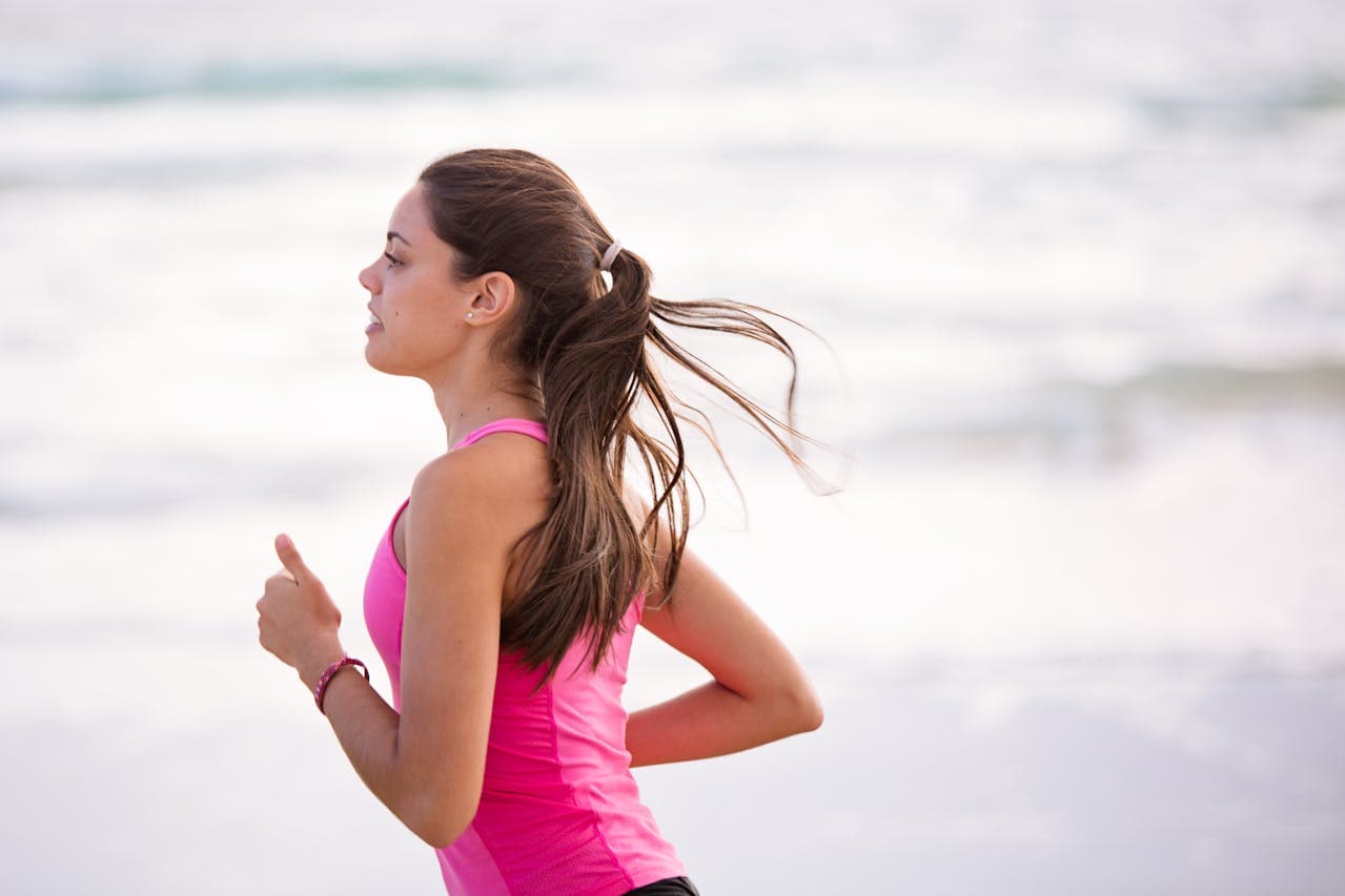 Running woman in a pink shirt